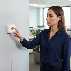 Female worker pressing QA-LWA alarm